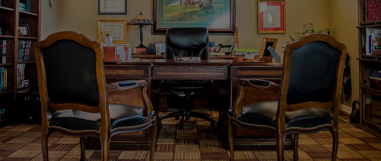 Traditional wooden office desk and chairs